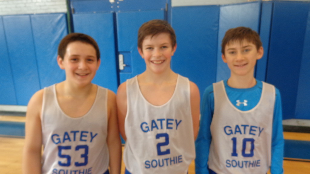James Dalta (from left), Jake Harrison, and Max Mercer who are on the seventh and eighth grade Gate of Heaven travel team are enjoying hoop this season. They are coached by Mike Alessandro and Sean Monahan.
