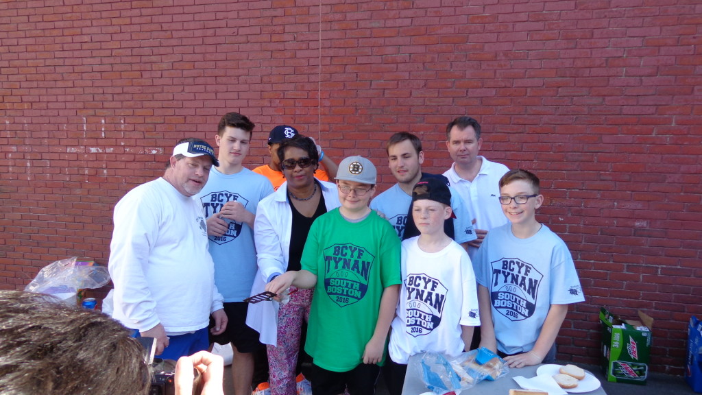 Boston Centers for Youth and Families (BCYF) staff are pictured with wiffle ball participants.
