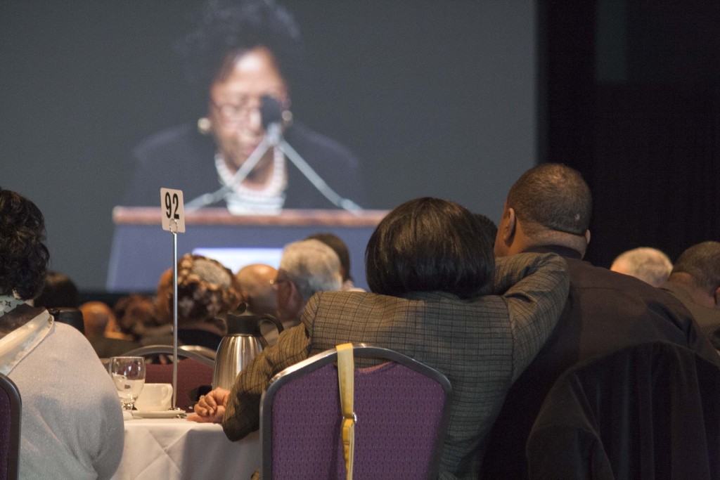 A couple listens to Dr. Ruth Simmons, the keynote speaker, at the Rev. Dr. Marting Luther King, Jr., Memorial Breakfast at the Boston Convention and Exhibition Center on Monday, Jan. 18, 2016.