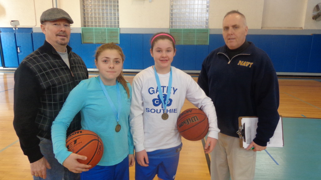 Pictured (from left) at the annual Knights of Columbus free throw event at the Walsh gym is Knights of Columbus volunteer, Paul Lyons, free throw participants Emma Gillis and Cara DiMaggio, and community volunteer Ed Flynn. 