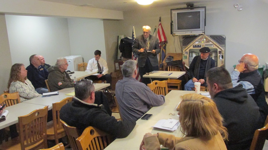 Commander Bill Desmond (standing) convenes the Allied War Veterans Council, for the recent parade meeting at the McDonough Post.
