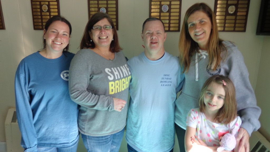 Pictured (from left) are program volunteers, Jennifer and Kellie, bowling league super bowler, Richie, and program volunteers, Cheryl and Hayden.