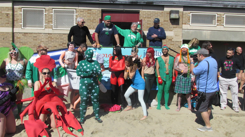 The costumed plungers line up for the “Best Costume” contest before the Shamrock Splash Plunge.