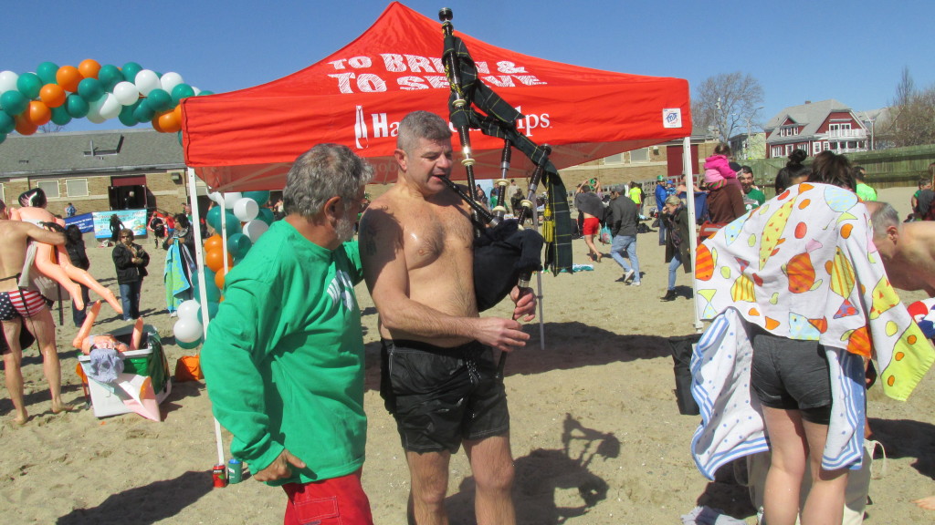 Chief Instigator Bruce Berman listens as Kenny Tallent pipes the plungers back on shore.