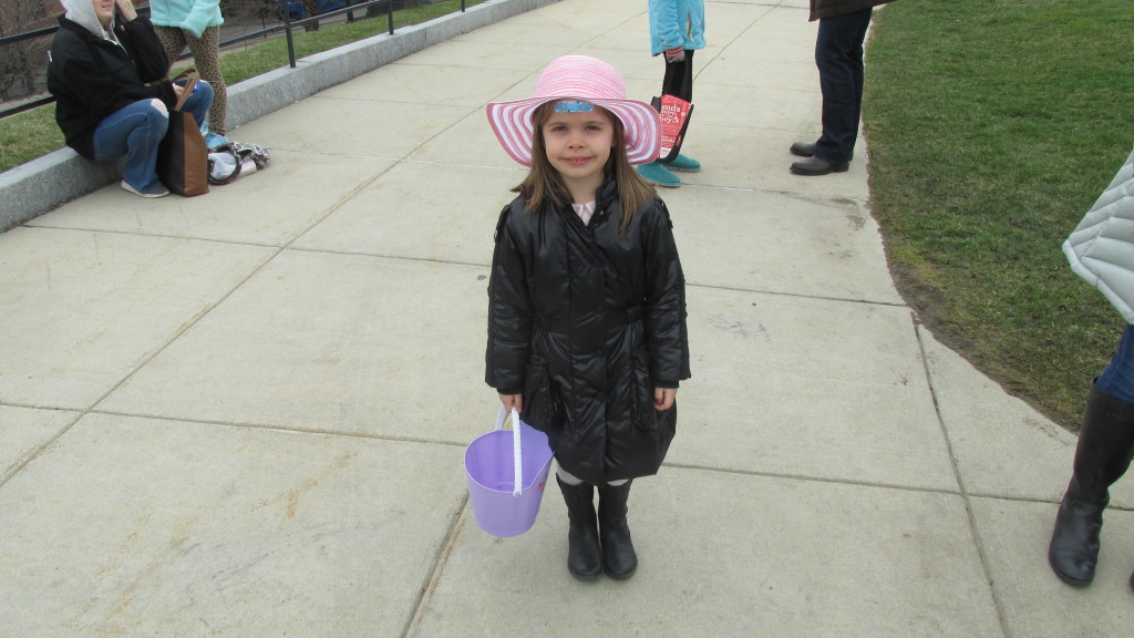 Young Emily, in her Easter bonnet, is all ready for the Easter egg hunt.