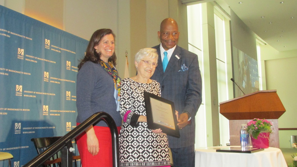 – Dorchester’s Pat O’Neill holds her 2016 Quinn Award for Outstanding Community Leadership, presented by Chancellor Motley and Claudina Quinn.