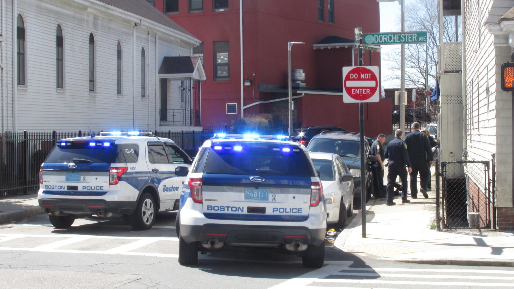 Police cars block off the end of Fr. Songin Way, where it intersects Dorchester Avenue, as they close in on a pair of alleged shoplifters. (Photo by Rick Winterson)