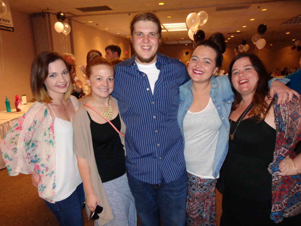 Ollie Long is pictured with an entourage of women. (Photo by Kevin Devlin)