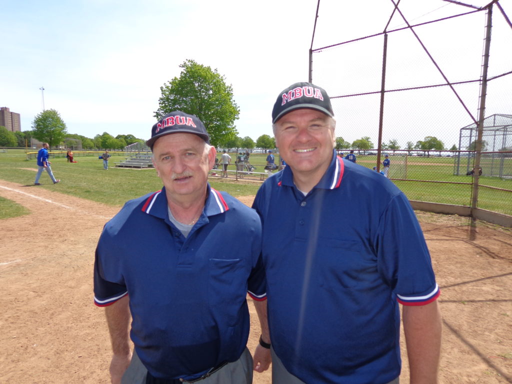 Pictured at Moakley Park umpiring the BCCS baseball game is Bobby McGarrell (left) and Kevin Lally. (Photo by Kevin Devlin)