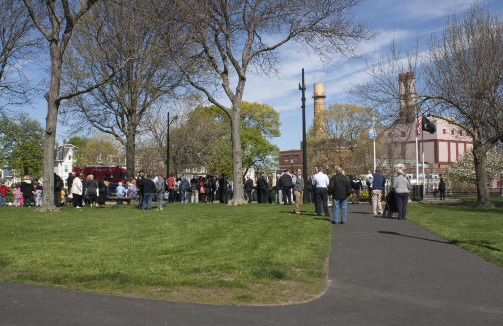 Community members wait for the arrival of Boston Mayor Martin J. Walsh at Medal of Honor Park on Tuesday, May 10, 2016. This is the 18th year of the city's annual Neighborhood Coffee Hour Series. (Photo by Susan Doucet)