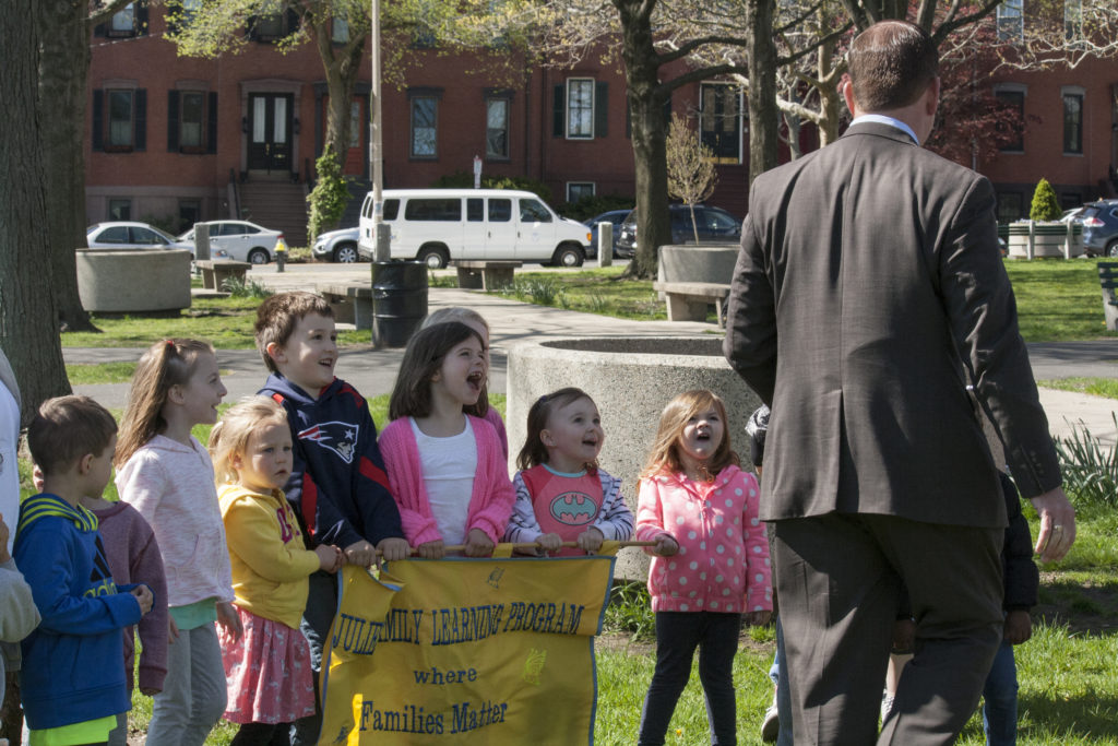 Children from Julie's Family Learning Program in South Boston yell in excitement as Mayor Martin J. Walsh walks over to take a photo with them at the neighborhood coffee hour at Medal of Honor Park on Tuesday, May 10, 2016. (Photo by Susan Doucet)