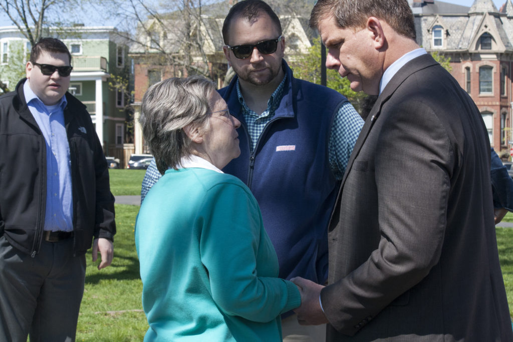 Sr. Maryadele Robinson speaks to Boston Mayor Martin J. Walsh while Eric Prentis looks on at the neighborhood coffee hour at Medal of Honor Park on Tuesday, May 10, 2016. (Photo by Susan Doucet)