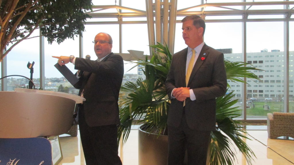 Auctioneer Tom Tinlin auctions off mayoral lunches with Boston Mayor Martin J. Walsh. (Photo by Rick Winterson)
