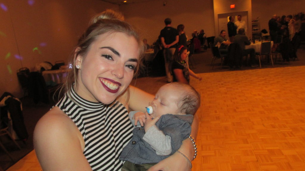 Lauren (Donnie Lewis’s niece and god-daughter) with young James – two months old – at Donnie’s Disco Ball fundraiser for the Leukemia & Lymphoma Society. (Photo by Rick Winterson)