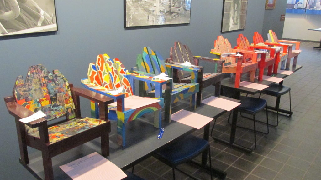 Brightly painted Adirondack chairs – a Community Day specialty. (Photo by Rick Winterson)