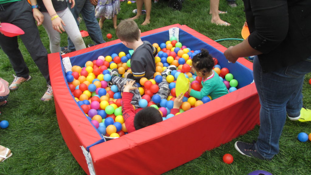 Children play in a ball pit at the Lawn on Day on May 21, 2016. (Photo by Rick Winterson)