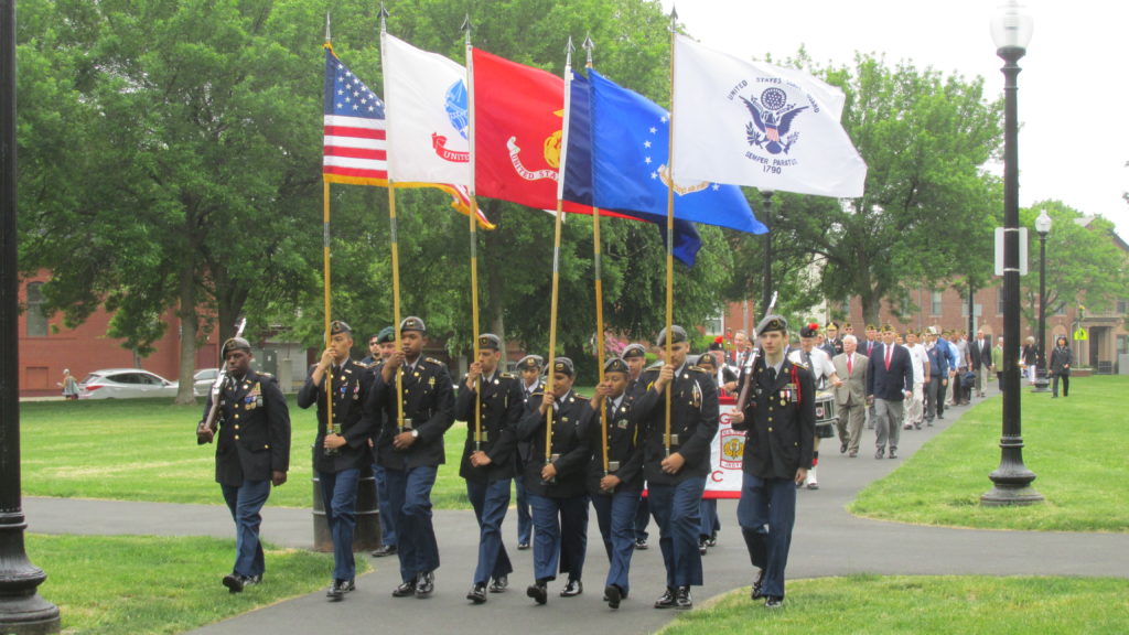 The High School ROTC Color Guard smartly leads the Memorial Parade into Medal of Honor Park.