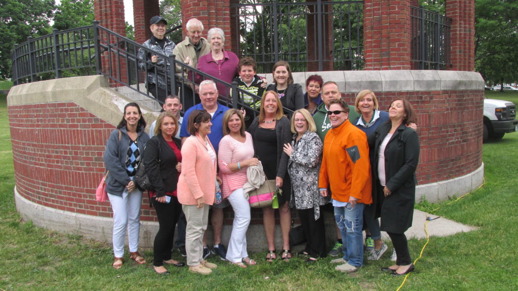  Joanie Lynch (front, center) with her friends and family at the bandstand.  Joanie was honored by receiving the Collaborative Center’s Joe Walsh “Community Servise” Award. 