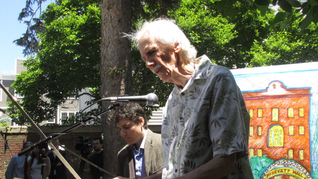 Poet Alan O’Hare, accompanied by accordionist Cullin Kadis, reads his verse for Paul McDevitt.