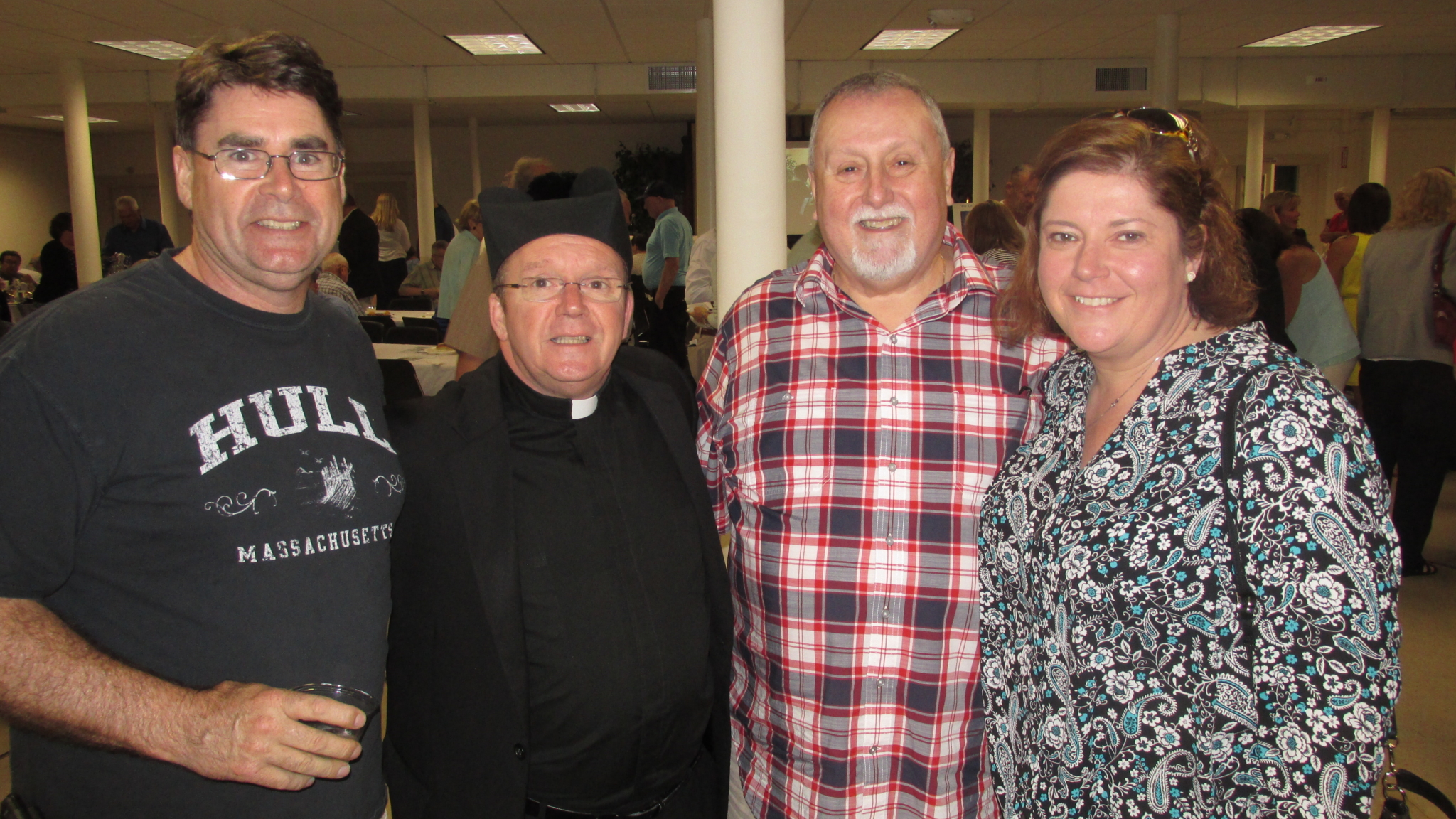 Fr. Joe (check that biretta!) with a few of his 500 well-wishers at his 25th Anniversary Celebration – Philip, Peter, and Helena (with an “a”).