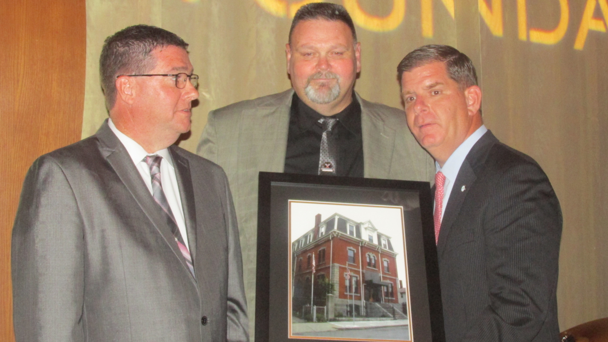 Mayor Marty Walsh (r.) presents the Gavin’s “Caring Hearts” Award to Business Agent Peter Gibbons and Mark Fortune of the Sprinkler Fitters Local 550. 