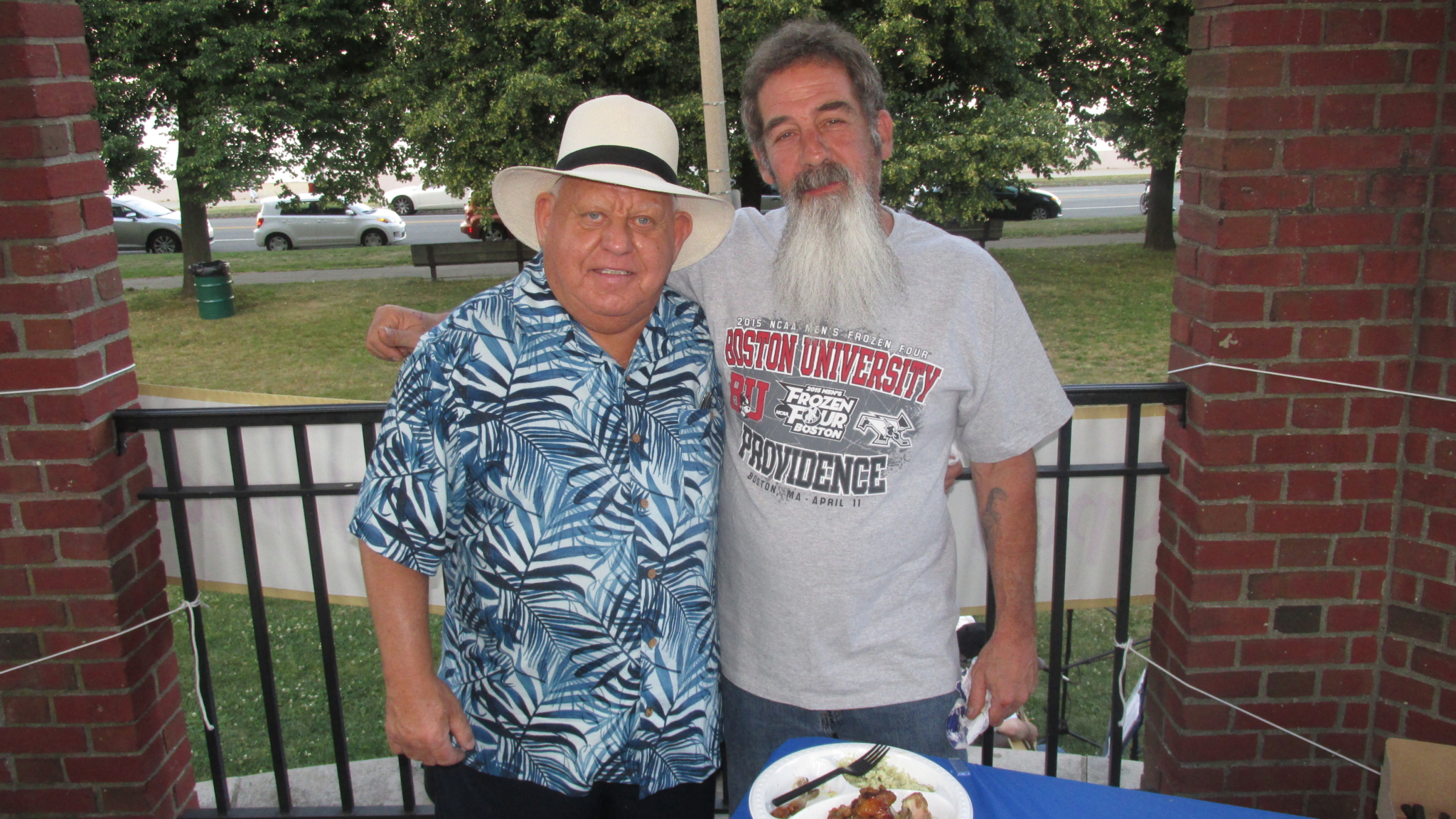 Tom White (l.) and friend dish out the steak tips at Tom’s dinner cookout for the Gavin’s “Open Hearts/Open Homes” gala fundraiser. 