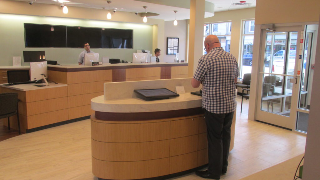 The clean lines and business-like atmosphere inside the South Boston Branch of Dedham Savings are also spacious and welcoming.