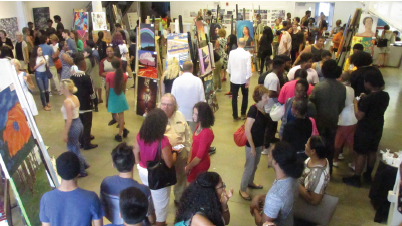 The crowded exhibition floor at Artists for Humanity’s recent (Wednesday, August 17) STEAM exhibition of their young artists.