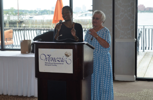 State Sen. Linda Dorcena-Forry and Sr. Peggy Youngclaus address the crowd at the annual breakfast.